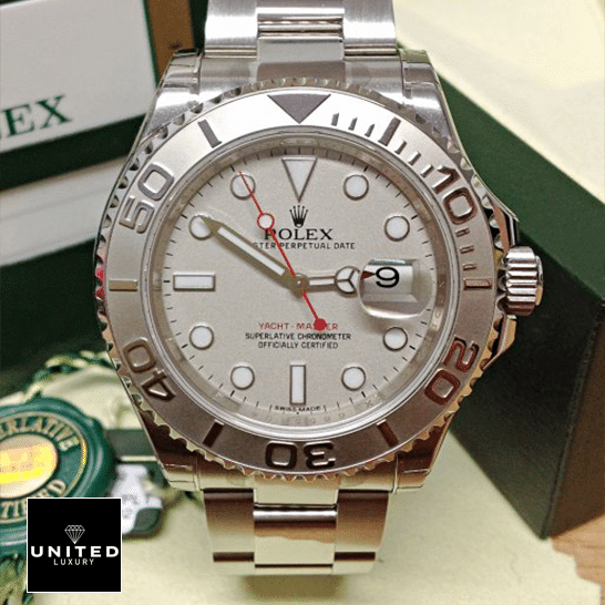Rolex Oyster Perpetual Yacht-Master Replica 2 Rolex Yacht Master Platinum Dial Steel Replica next to warranty card